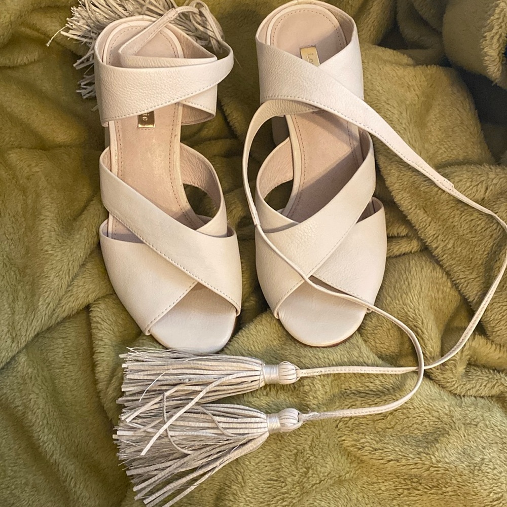 Beautiful cream colored leather open toe ankle tie high heels